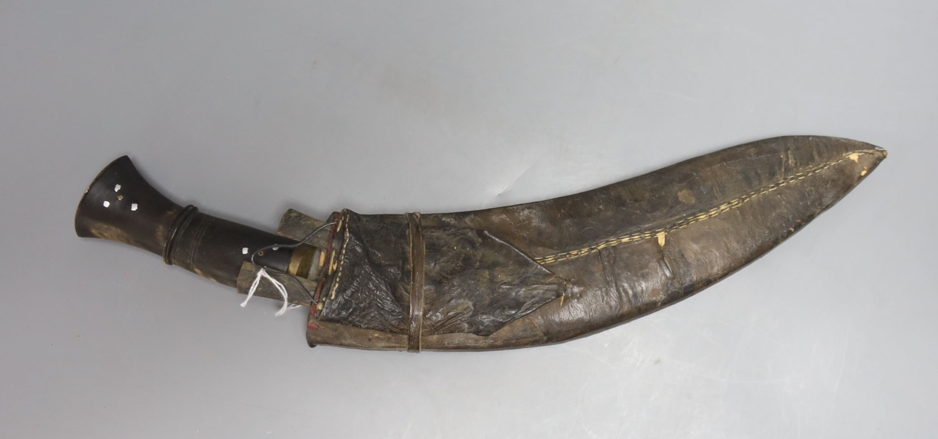 A Nepalese curved kukri with enamel inlaid sheath